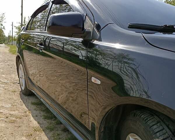 Черный Мицубиси Лансер, объемом двигателя 2 л и пробегом 214 тыс. км за 6300 $, фото 4 на Automoto.ua