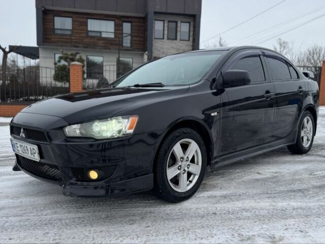 Черный Мицубиси Лансер, объемом двигателя 2 л и пробегом 280 тыс. км за 6800 $, фото 5 на Automoto.ua
