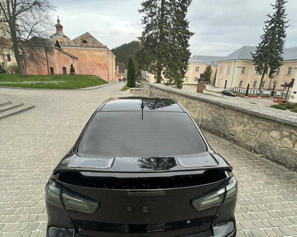 Черный Мицубиси Лансер, объемом двигателя 2 л и пробегом 165 тыс. км за 6900 $, фото 2 на Automoto.ua