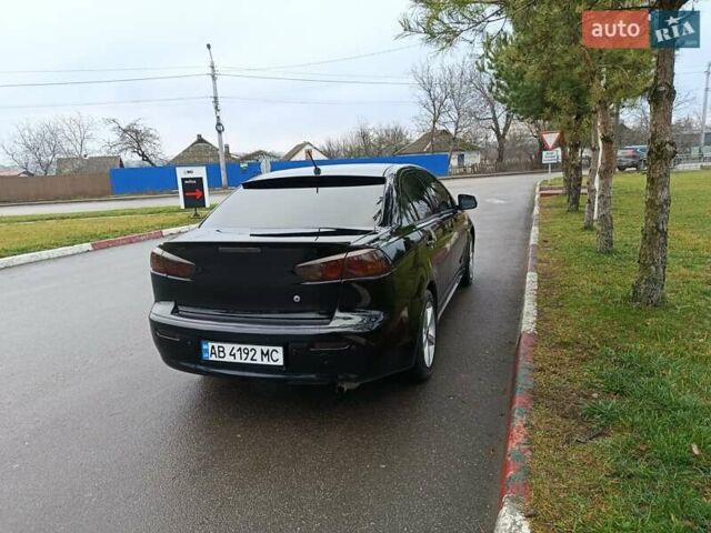 Черный Мицубиси Лансер, объемом двигателя 2 л и пробегом 200 тыс. км за 5100 $, фото 13 на Automoto.ua