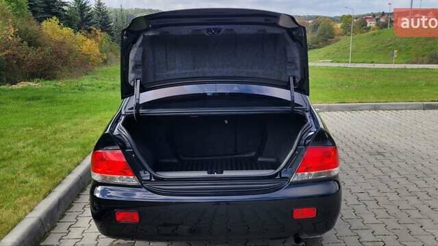 Міцубісі Lancer 2008 у Тернополі на Automoto.ua Чорний Міцубісі Lancer, об'ємом двигуна 1.58 л та пробігом 182 тис. км за 5600 $, фото 12 на Automoto.ua