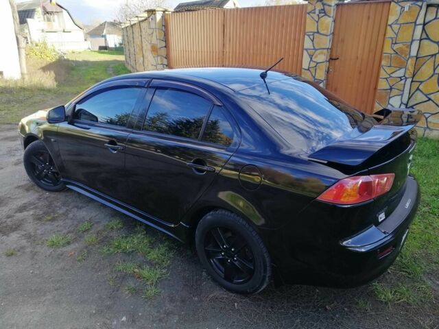 Міцубісі Lancer 2008 у Києві на Automoto.ua Чорний Міцубісі Lancer, об'ємом двигуна 2 л та пробігом 196 тис. км за 5500 $, фото 2 на Automoto.ua