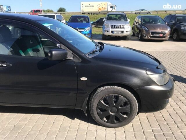 Чорний Міцубісі Lancer, об'ємом двигуна 1.6 л та пробігом 356 тис. км за 4590 $, фото 8 на Automoto.ua