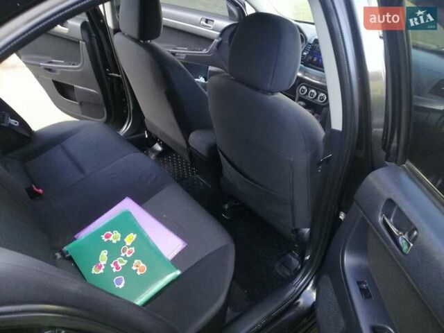 Мицубиси Лансер 2008 в Киеве на Automoto.ua Черный Мицубиси Лансер, объемом двигателя 2 л и пробегом 196 тыс. км за 5500 $, фото 25 на Automoto.ua