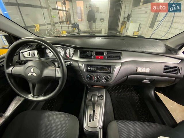 Чорний Міцубісі Lancer, об'ємом двигуна 1.58 л та пробігом 327 тис. км за 4000 $, фото 11 на Automoto.ua