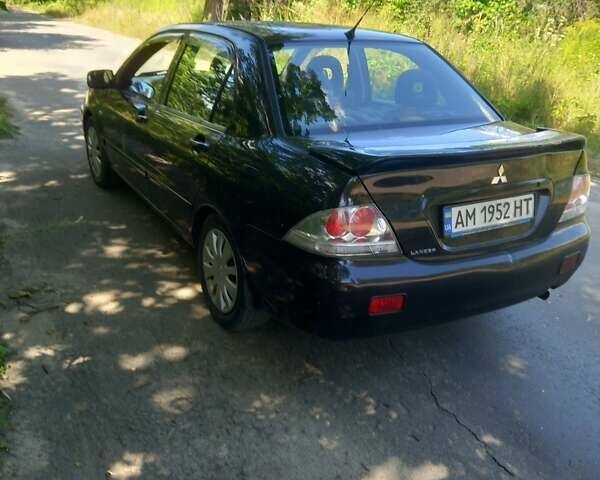 Черный Мицубиси Лансер, объемом двигателя 1.6 л и пробегом 320 тыс. км за 3800 $, фото 6 на Automoto.ua