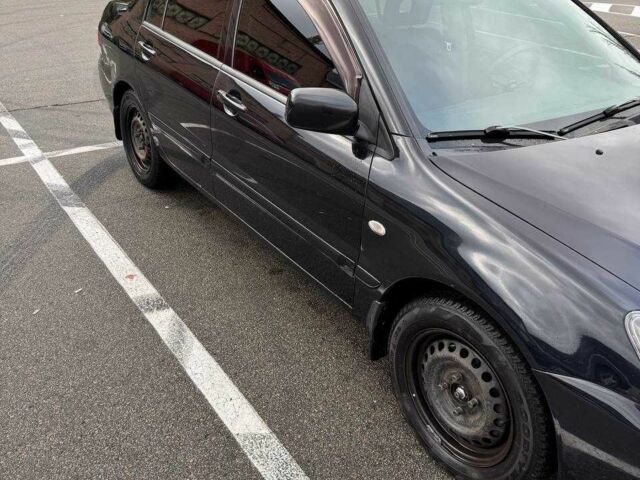 Чорний Міцубісі Lancer, об'ємом двигуна 1.6 л та пробігом 245 тис. км за 4500 $, фото 2 на Automoto.ua