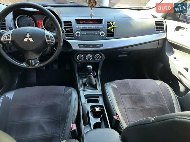 Черный Мицубиси Лансер, объемом двигателя 2 л и пробегом 230 тыс. км за 7000 $, фото 14 на Automoto.ua