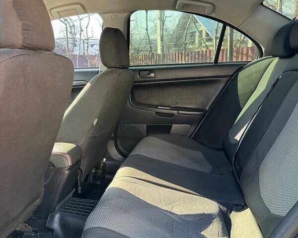 Чорний Міцубісі Lancer, об'ємом двигуна 2 л та пробігом 150 тис. км за 6500 $, фото 9 на Automoto.ua