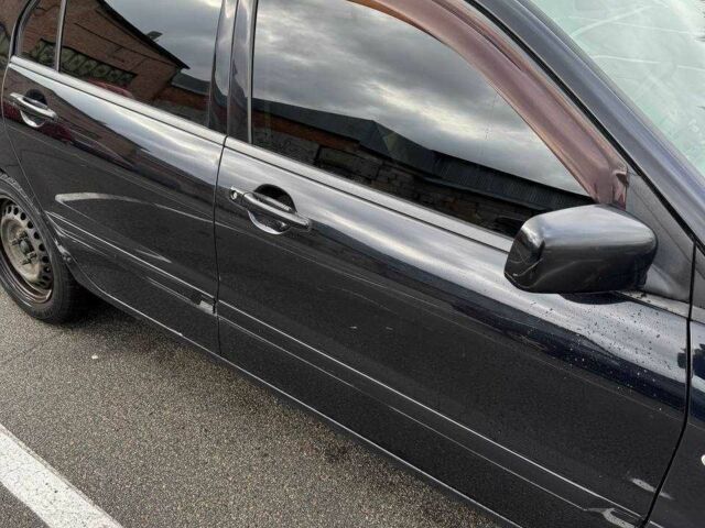 Чорний Міцубісі Lancer, об'ємом двигуна 1.6 л та пробігом 245 тис. км за 4500 $, фото 3 на Automoto.ua