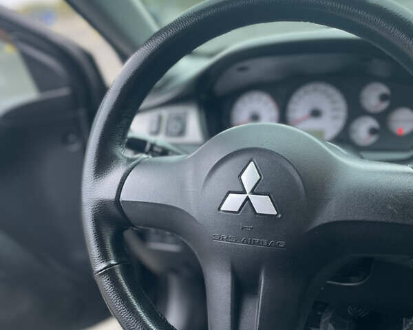 Міцубісі Lancer 2008 у Києві на Automoto.ua Чорний Міцубісі Lancer, об'ємом двигуна 1.58 л та пробігом 300 тис. км за 3800 $, фото 4 на Automoto.ua