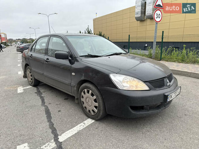 Чорний Міцубісі Lancer, об'ємом двигуна 1.58 л та пробігом 388 тис. км за 2300 $, фото 3 на Automoto.ua