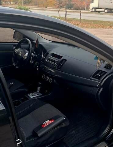 Черный Мицубиси Лансер, объемом двигателя 2 л и пробегом 211 тыс. км за 6900 $, фото 7 на Automoto.ua