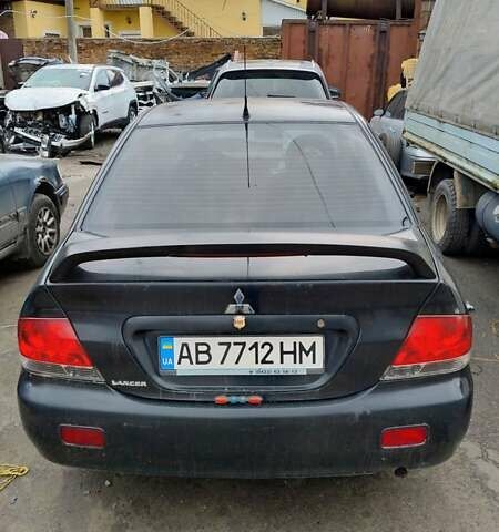 Черный Мицубиси Лансер, объемом двигателя 1.6 л и пробегом 200 тыс. км за 2000 $, фото 3 на Automoto.ua