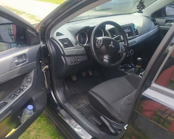 Чорний Міцубісі Lancer, об'ємом двигуна 2 л та пробігом 183 тис. км за 5000 $, фото 6 на Automoto.ua