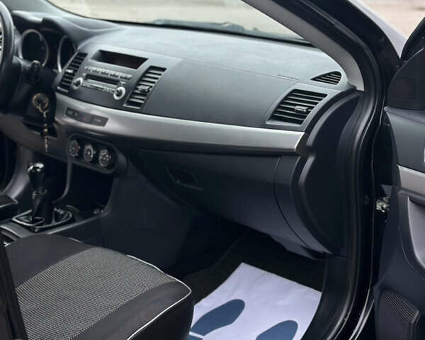 Чорний Міцубісі Lancer, об'ємом двигуна 1.5 л та пробігом 111 тис. км за 6999 $, фото 57 на Automoto.ua