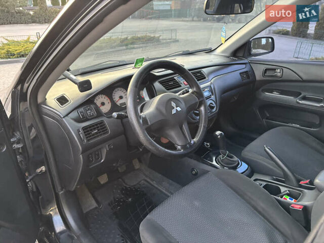 Чорний Міцубісі Lancer, об'ємом двигуна 1.58 л та пробігом 344 тис. км за 3999 $, фото 10 на Automoto.ua