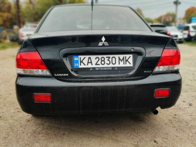 Чорний Міцубісі Lancer, об'ємом двигуна 1.6 л та пробігом 257 тис. км за 4200 $, фото 4 на Automoto.ua