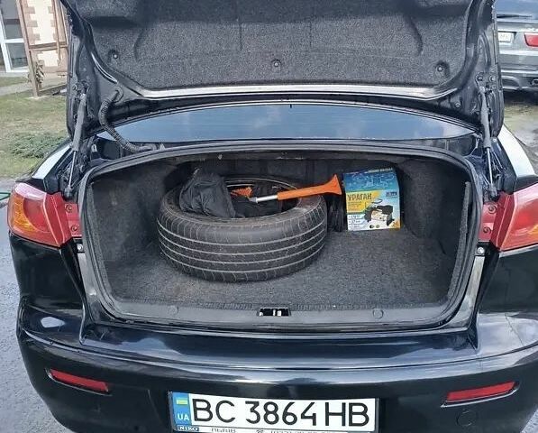 Черный Мицубиси Лансер, объемом двигателя 2 л и пробегом 210 тыс. км за 6500 $, фото 12 на Automoto.ua