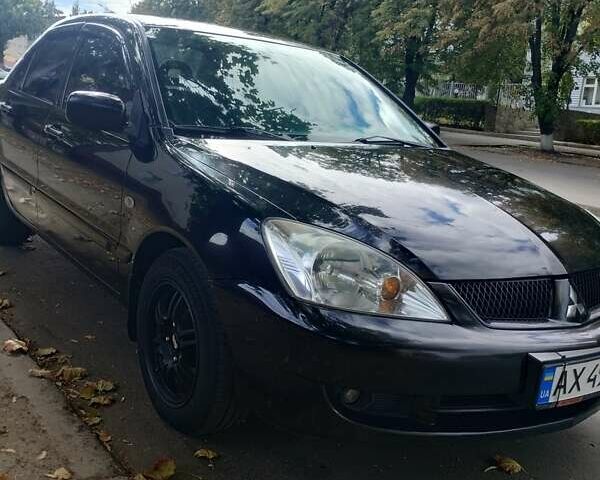 Чорний Міцубісі Lancer, об'ємом двигуна 1.58 л та пробігом 323 тис. км за 4500 $, фото 8 на Automoto.ua