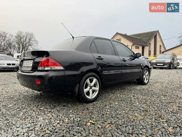 Черный Мицубиси Лансер, объемом двигателя 1.58 л и пробегом 202 тыс. км за 4100 $, фото 4 на Automoto.ua