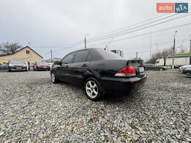 Черный Мицубиси Лансер, объемом двигателя 1.58 л и пробегом 202 тыс. км за 4100 $, фото 14 на Automoto.ua