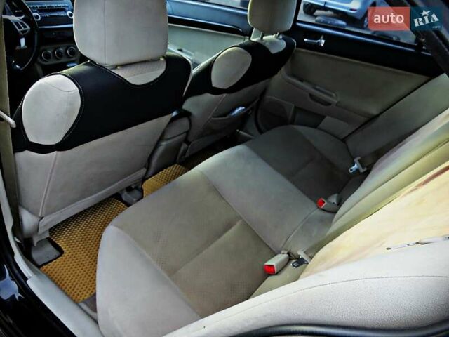 Мицубиси Лансер 2008 в Черкассах на Automoto.ua Черный Мицубиси Лансер, объемом двигателя 2 л и пробегом 178 тыс. км за 7400 $, фото 13 на Automoto.ua