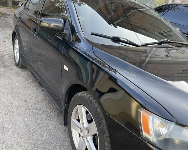 Чорний Міцубісі Lancer, об'ємом двигуна 2 л та пробігом 255 тис. км за 6999 $, фото 14 на Automoto.ua