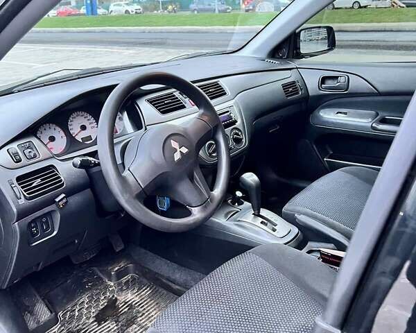 Чорний Міцубісі Lancer, об'ємом двигуна 1.6 л та пробігом 300 тис. км за 5500 $, фото 10 на Automoto.ua