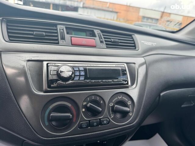 Мицубиси Лансер 2008 в Запорожье на Automoto.ua Черный Мицубиси Лансер, объемом двигателя 1.6 л и пробегом 316 тыс. км за 4290 $, фото 16 на Automoto.ua