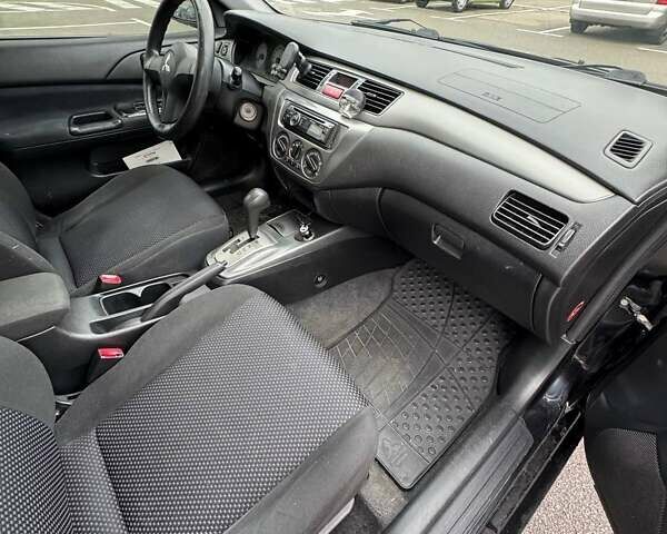 Чорний Міцубісі Lancer, об'ємом двигуна 1.6 л та пробігом 245 тис. км за 4500 $, фото 19 на Automoto.ua