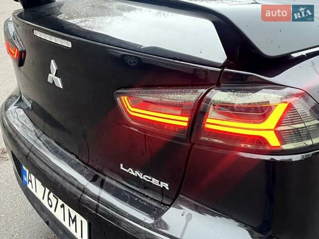 Черный Мицубиси Лансер, объемом двигателя 2 л и пробегом 217 тыс. км за 7000 $, фото 39 на Automoto.ua