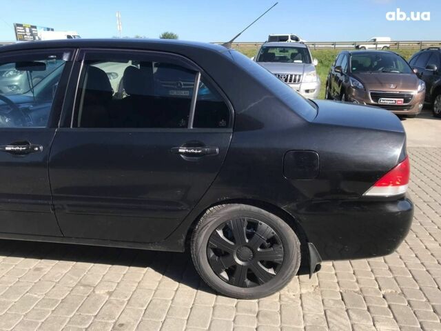 Чорний Міцубісі Lancer, об'ємом двигуна 1.6 л та пробігом 356 тис. км за 4590 $, фото 13 на Automoto.ua