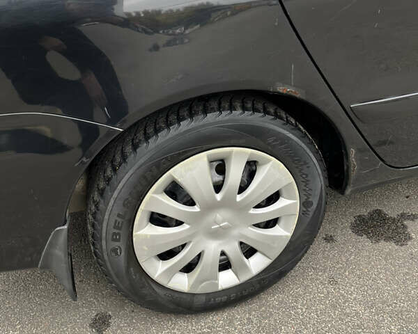 Чорний Міцубісі Lancer, об'ємом двигуна 1.58 л та пробігом 192 тис. км за 4500 $, фото 30 на Automoto.ua