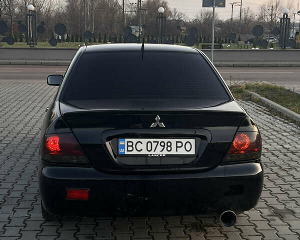 Черный Мицубиси Лансер, объемом двигателя 1.6 л и пробегом 245 тыс. км за 4300 $, фото 15 на Automoto.ua