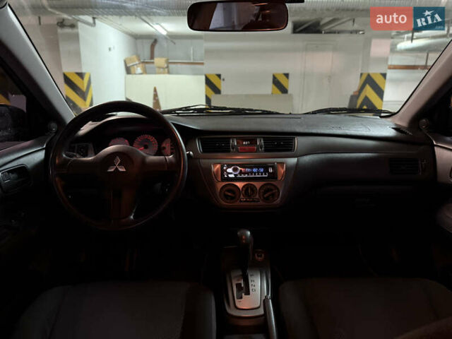 Чорний Міцубісі Lancer, об'ємом двигуна 1.58 л та пробігом 212 тис. км за 5500 $, фото 7 на Automoto.ua