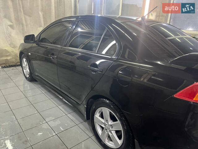 Черный Мицубиси Лансер, объемом двигателя 2 л и пробегом 200 тыс. км за 8000 $, фото 15 на Automoto.ua