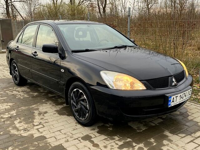 Черный Мицубиси Лансер, объемом двигателя 1.6 л и пробегом 240 тыс. км за 4200 $, фото 7 на Automoto.ua