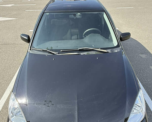 Черный Мицубиси Лансер, объемом двигателя 1.6 л и пробегом 321 тыс. км за 5000 $, фото 9 на Automoto.ua