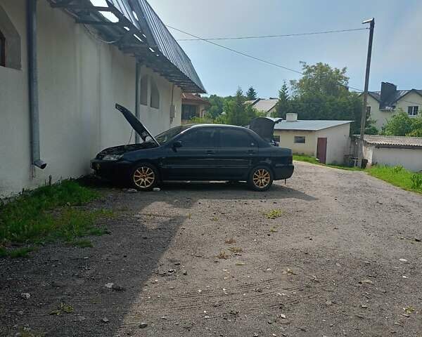 Мицубиси Лансер 2008 в Львове на Automoto.ua Черный Мицубиси Лансер, объемом двигателя 1.58 л и пробегом 200 тыс. км за 5200 $, фото 132 на Automoto.ua