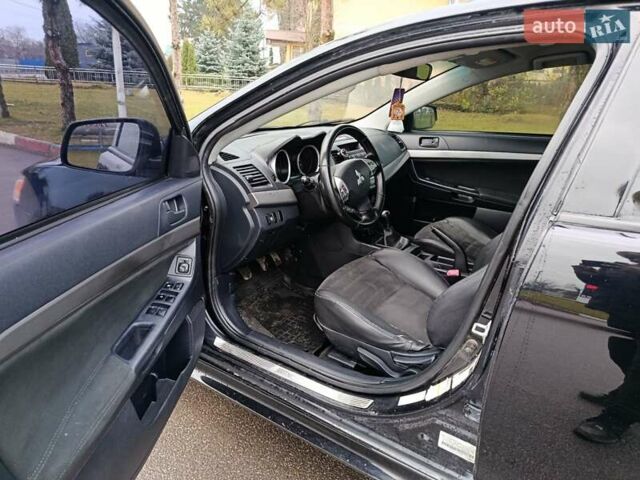 Черный Мицубиси Лансер, объемом двигателя 2 л и пробегом 200 тыс. км за 5100 $, фото 9 на Automoto.ua