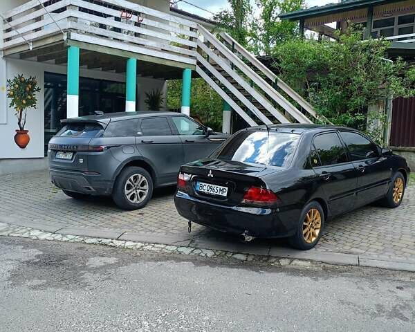 Мицубиси Лансер 2008 в Львове на Automoto.ua Черный Мицубиси Лансер, объемом двигателя 1.58 л и пробегом 200 тыс. км за 5200 $, фото 119 на Automoto.ua