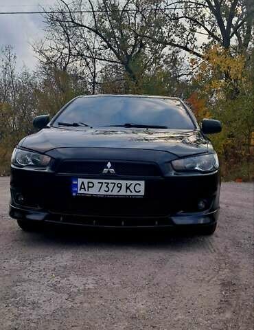 Черный Мицубиси Лансер, объемом двигателя 2 л и пробегом 211 тыс. км за 6900 $, фото 4 на Automoto.ua