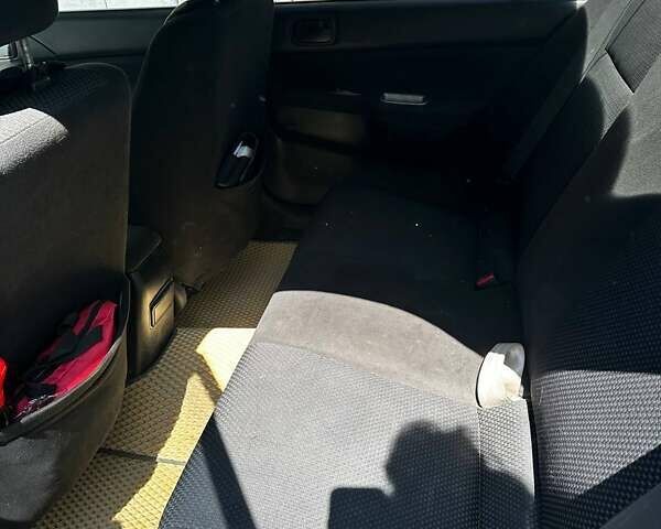 Чорний Міцубісі Lancer, об'ємом двигуна 1.6 л та пробігом 294 тис. км за 6500 $, фото 10 на Automoto.ua