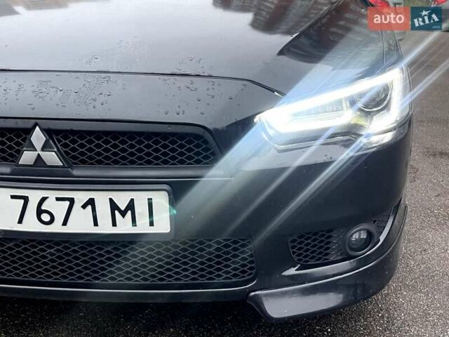 Черный Мицубиси Лансер, объемом двигателя 2 л и пробегом 217 тыс. км за 7000 $, фото 8 на Automoto.ua