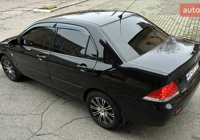 Чорний Міцубісі Lancer, об'ємом двигуна 1.58 л та пробігом 167 тис. км за 4800 $, фото 1 на Automoto.ua