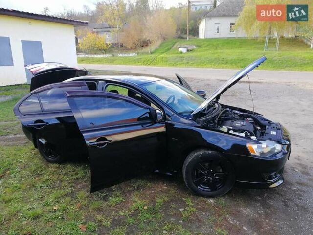 Мицубиси Лансер 2008 в Киеве на Automoto.ua Черный Мицубиси Лансер, объемом двигателя 2 л и пробегом 196 тыс. км за 5500 $, фото 35 на Automoto.ua