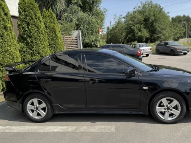 Чорний Міцубісі Lancer, об'ємом двигуна 2 л та пробігом 217 тис. км за 7700 $, фото 1 на Automoto.ua
