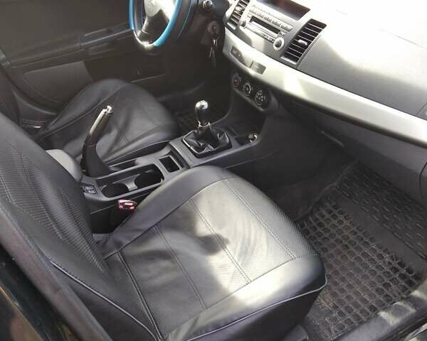 Черный Мицубиси Лансер, объемом двигателя 1.5 л и пробегом 219 тыс. км за 6000 $, фото 8 на Automoto.ua