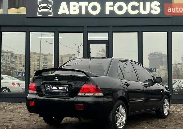 Чорний Міцубісі Lancer, об'ємом двигуна 1.6 л та пробігом 340 тис. км за 6190 $, фото 7 на Automoto.ua